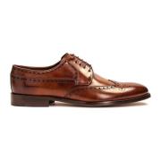 Klassiske brune brogues med en rosetdekoration