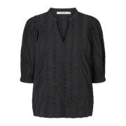 Elegant Sort Bluse med Moderne Detaljer